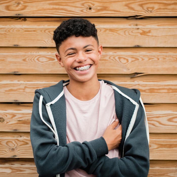 smiling teenage boy with braces